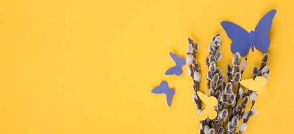 willow-branches-with-paper-butterflies-yellow-table